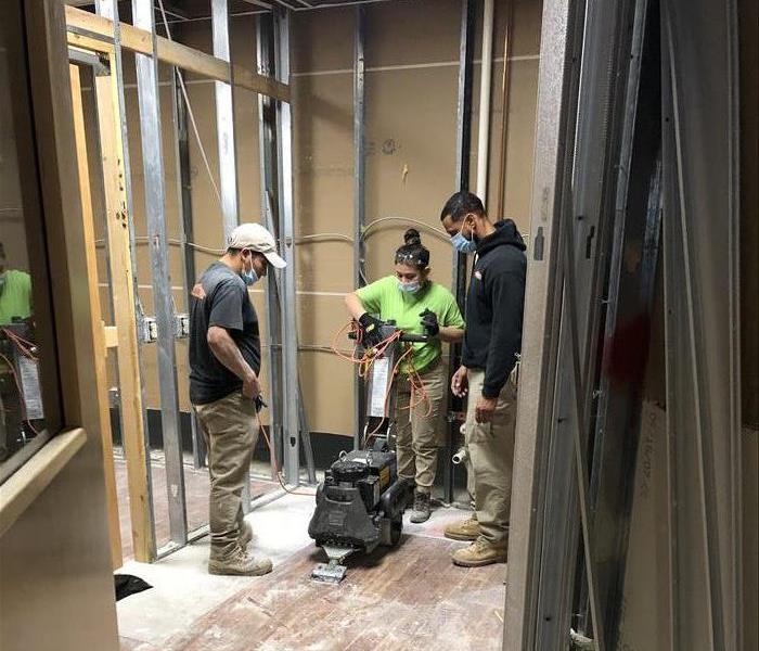 3 SERVPRO team members in action.