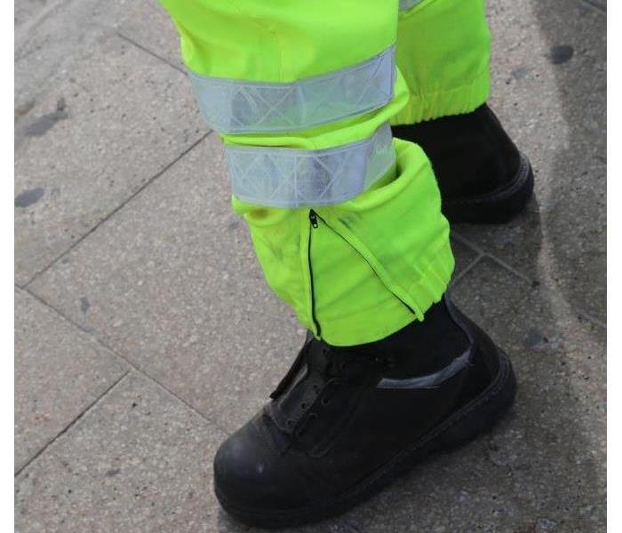 Civil protection men with high visibility clothing during an exercise to prevent flooding in the city